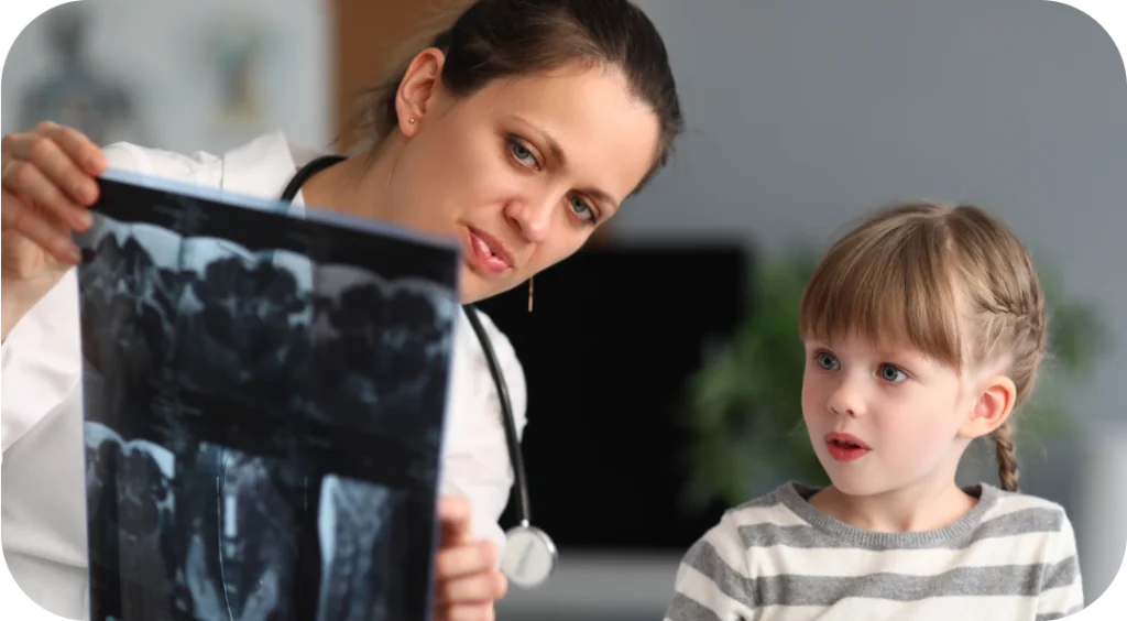 Doctor shows scans to a girl who is Toe Walking